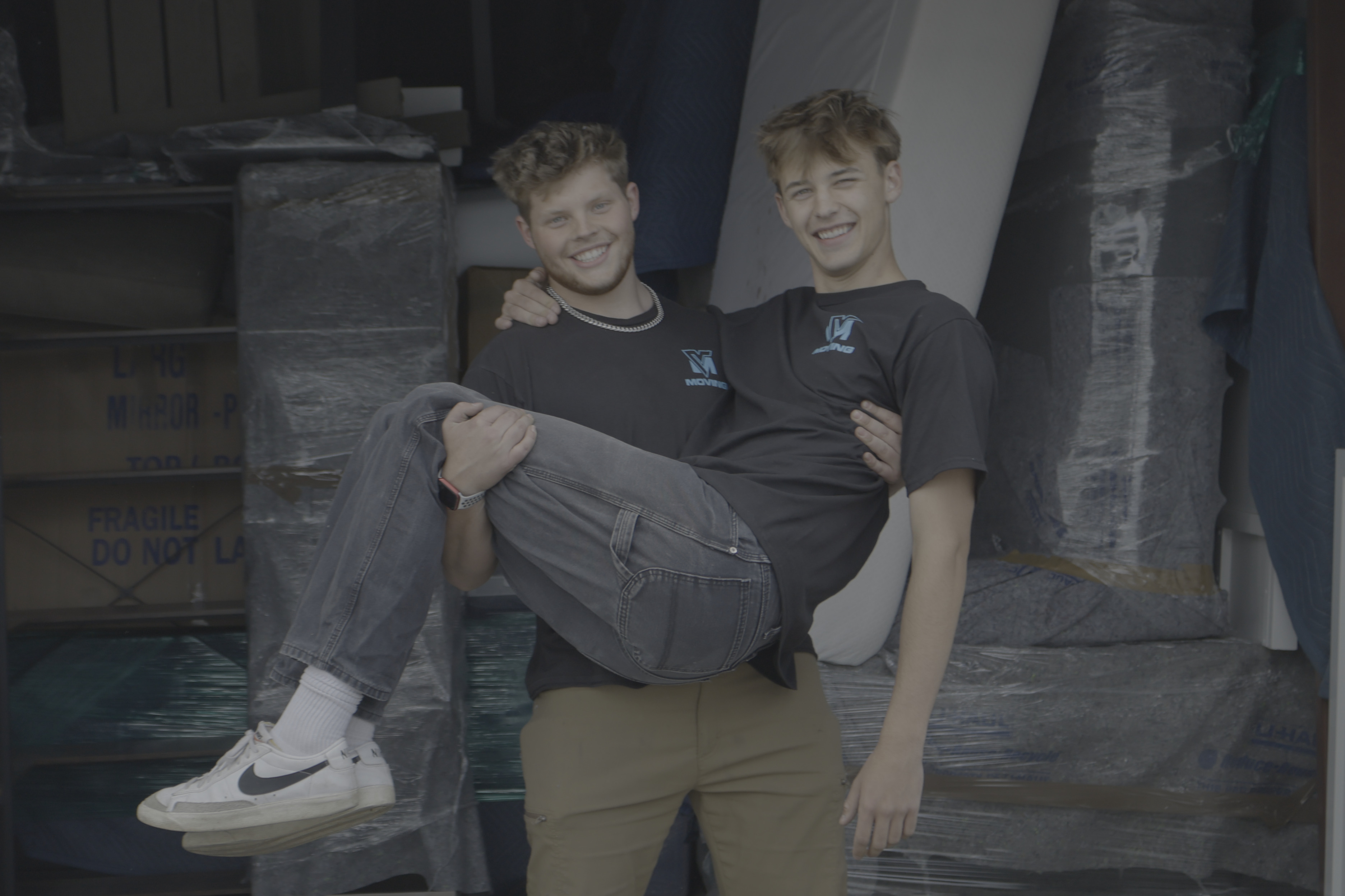 Manly Movers who are happy to be working and helping a moving customer.