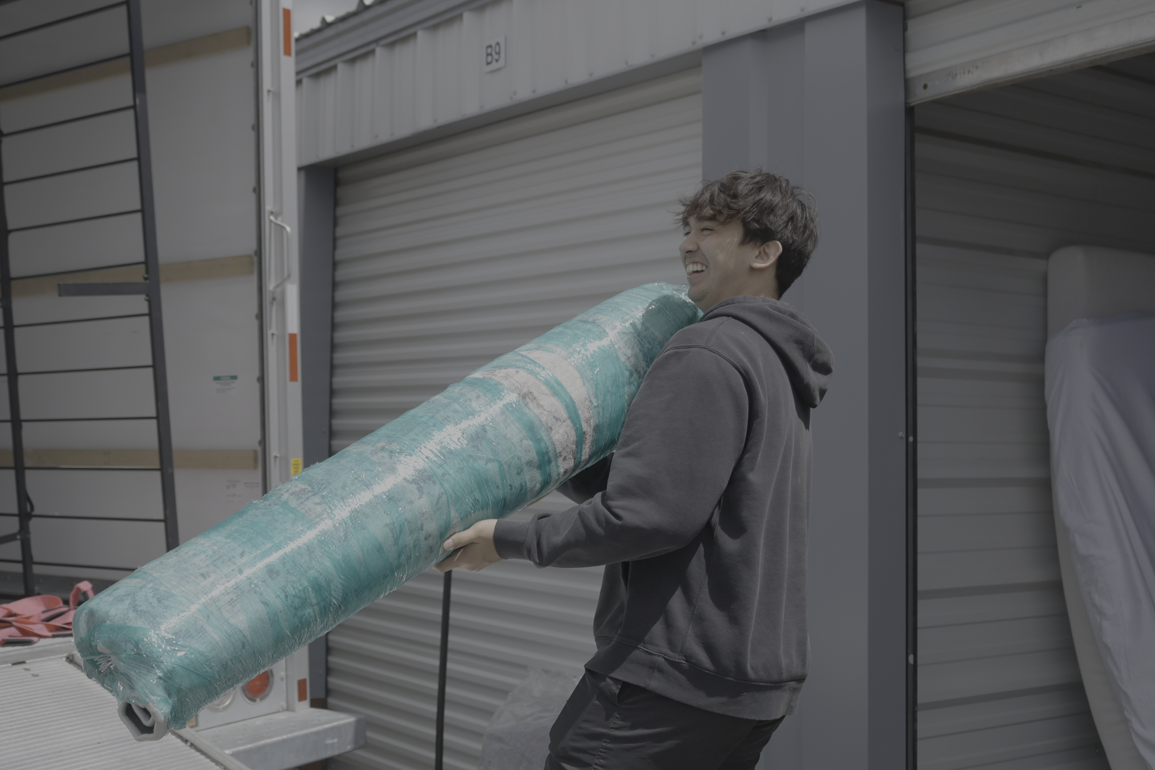 Manly Moving helping make a commercial moving experience a great experience by smiling and working hard.