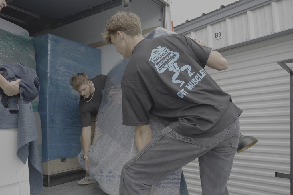 Manly Moving lifting something heavy into a moving truck