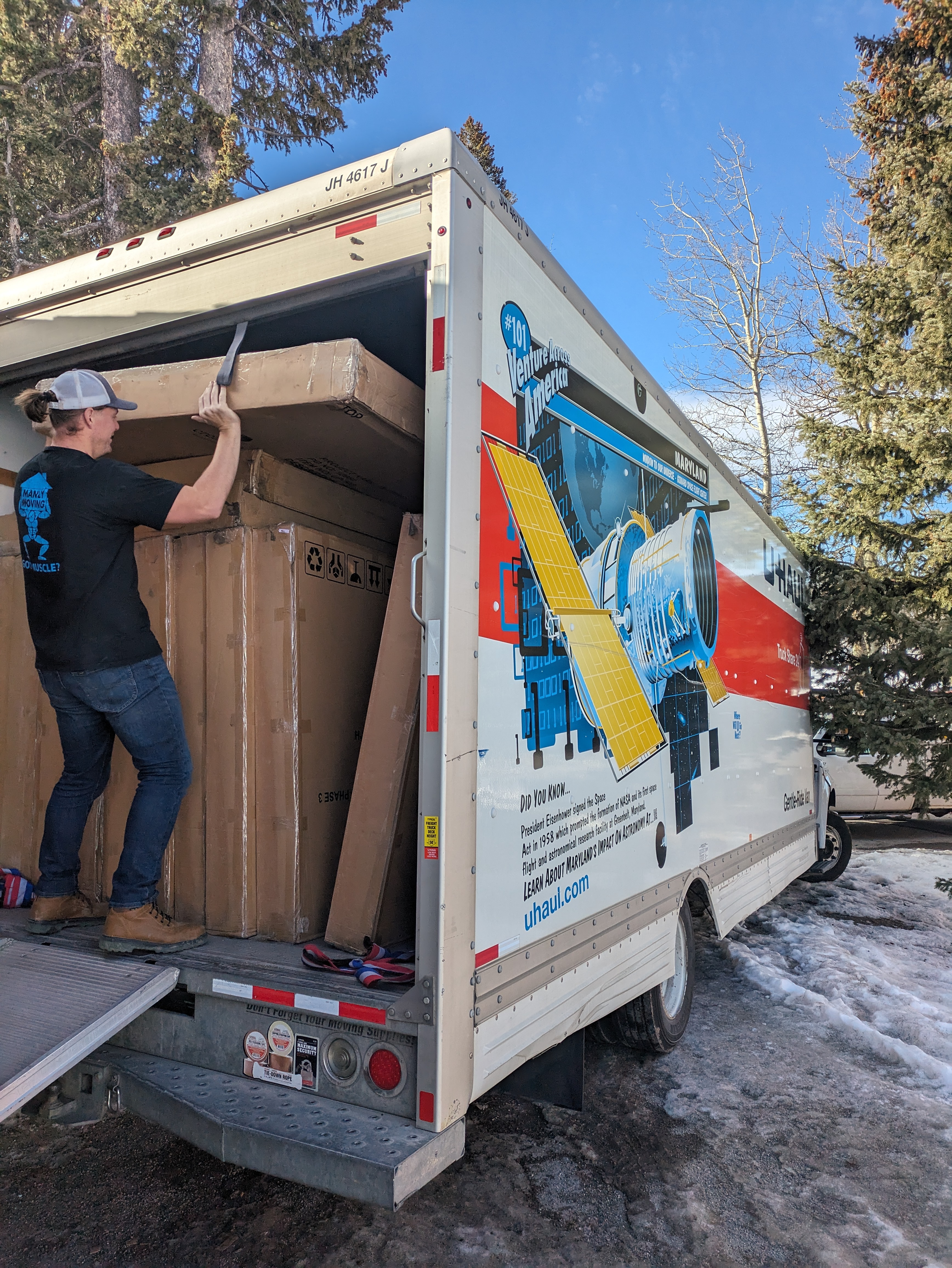 Unloading boxed furniture into a hotel and assembling it.